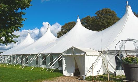 a line of portable restrooms in a shaded area, offering a comfortable experience for users in Piedmont